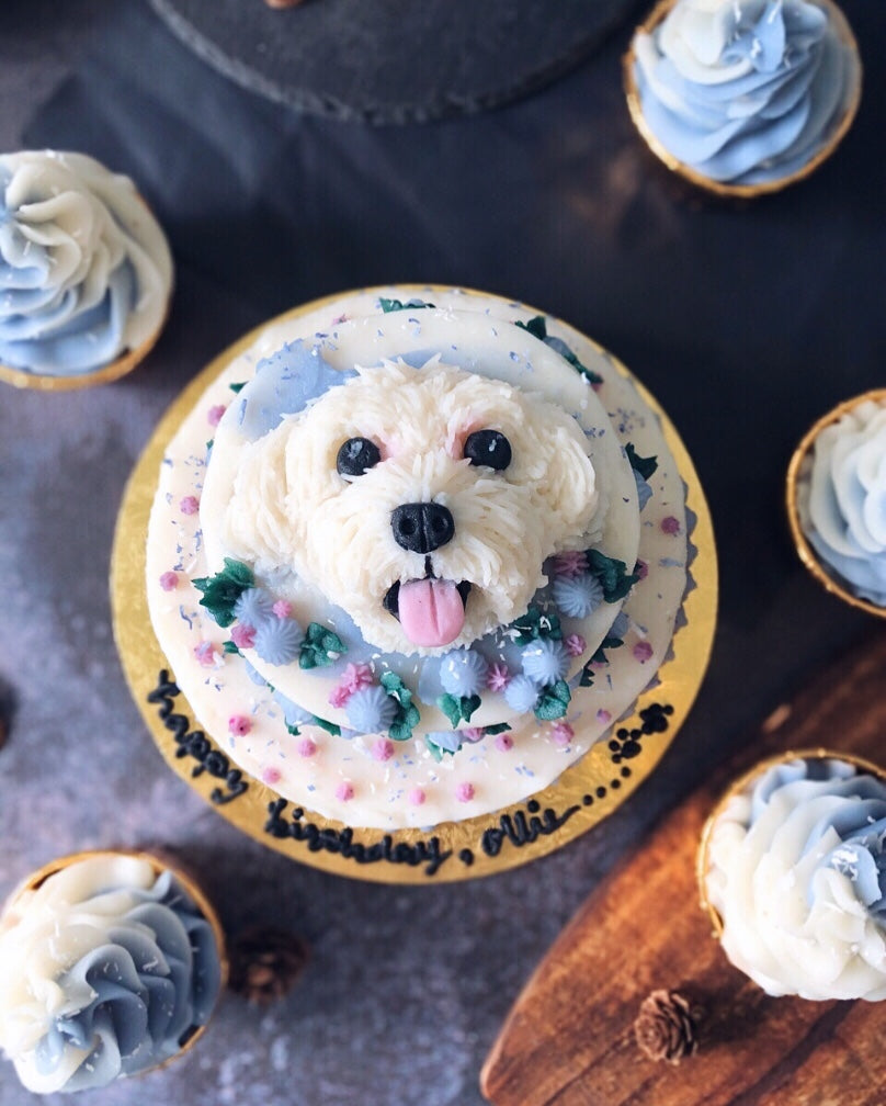 3D White Dog Face Cake on top of a Two Tier Cake